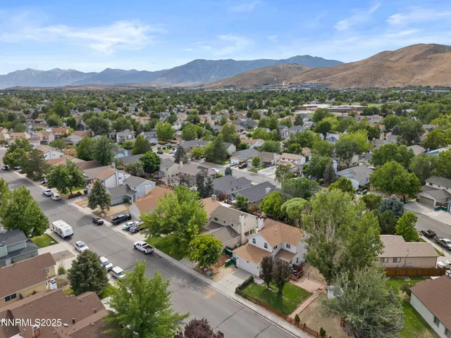 an aerial view of residential houses and outdoor space