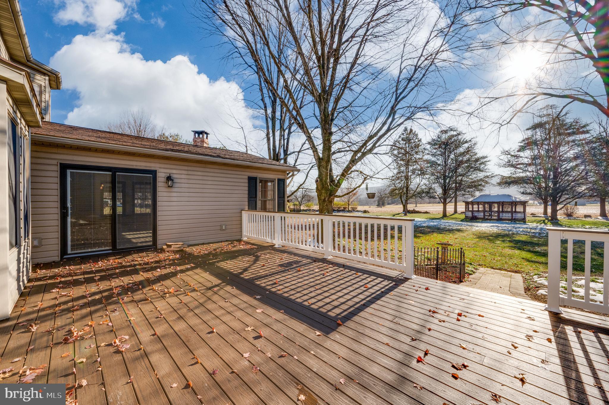 109 Bewley Lane Reading, PA 19605 - Photo 17 of 87 a view of a wooden deck with a yard