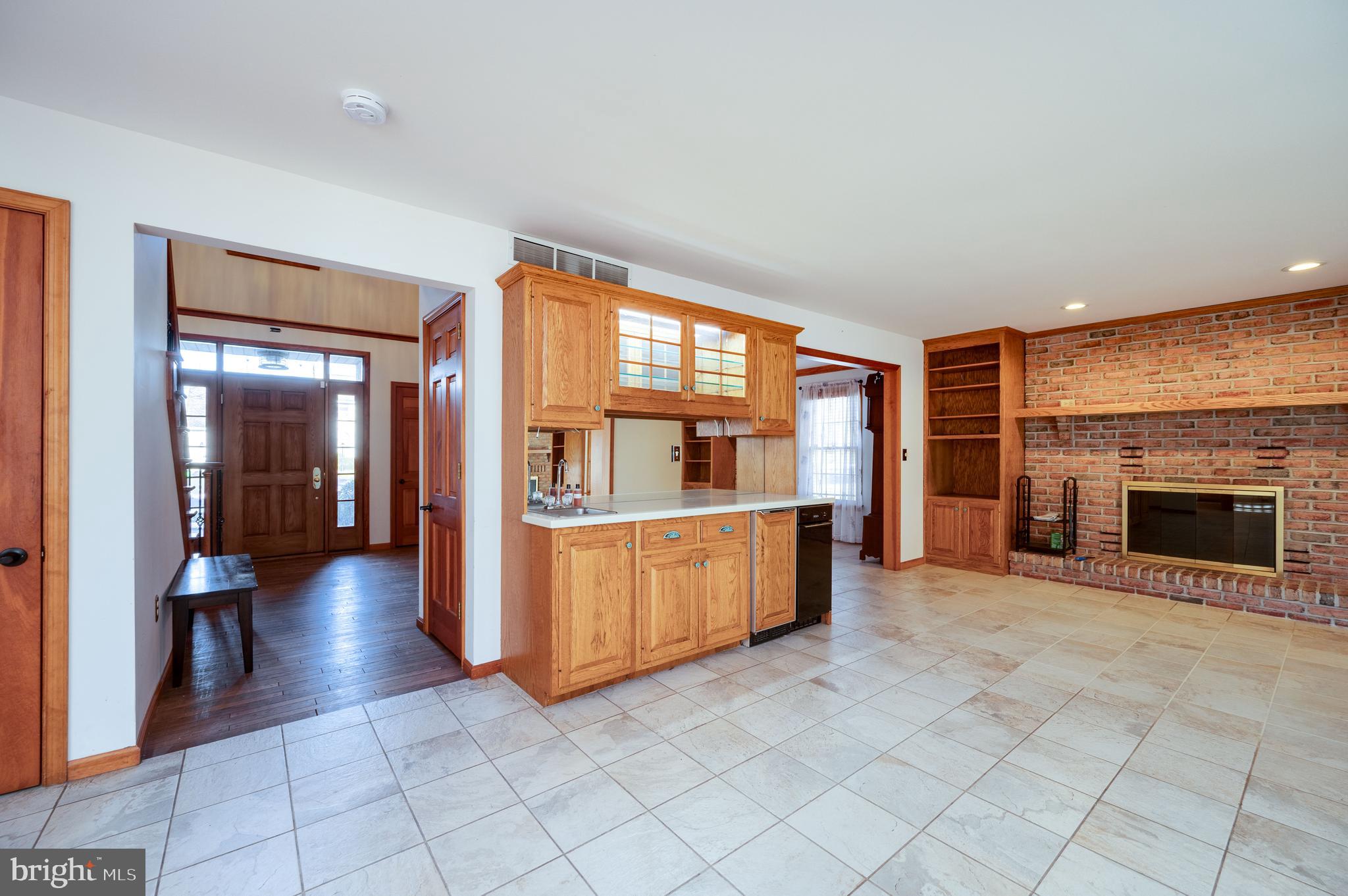 109 Bewley Lane Reading, PA 19605 - Photo 30 of 87 a view of a kitchen with furniture and a fireplace