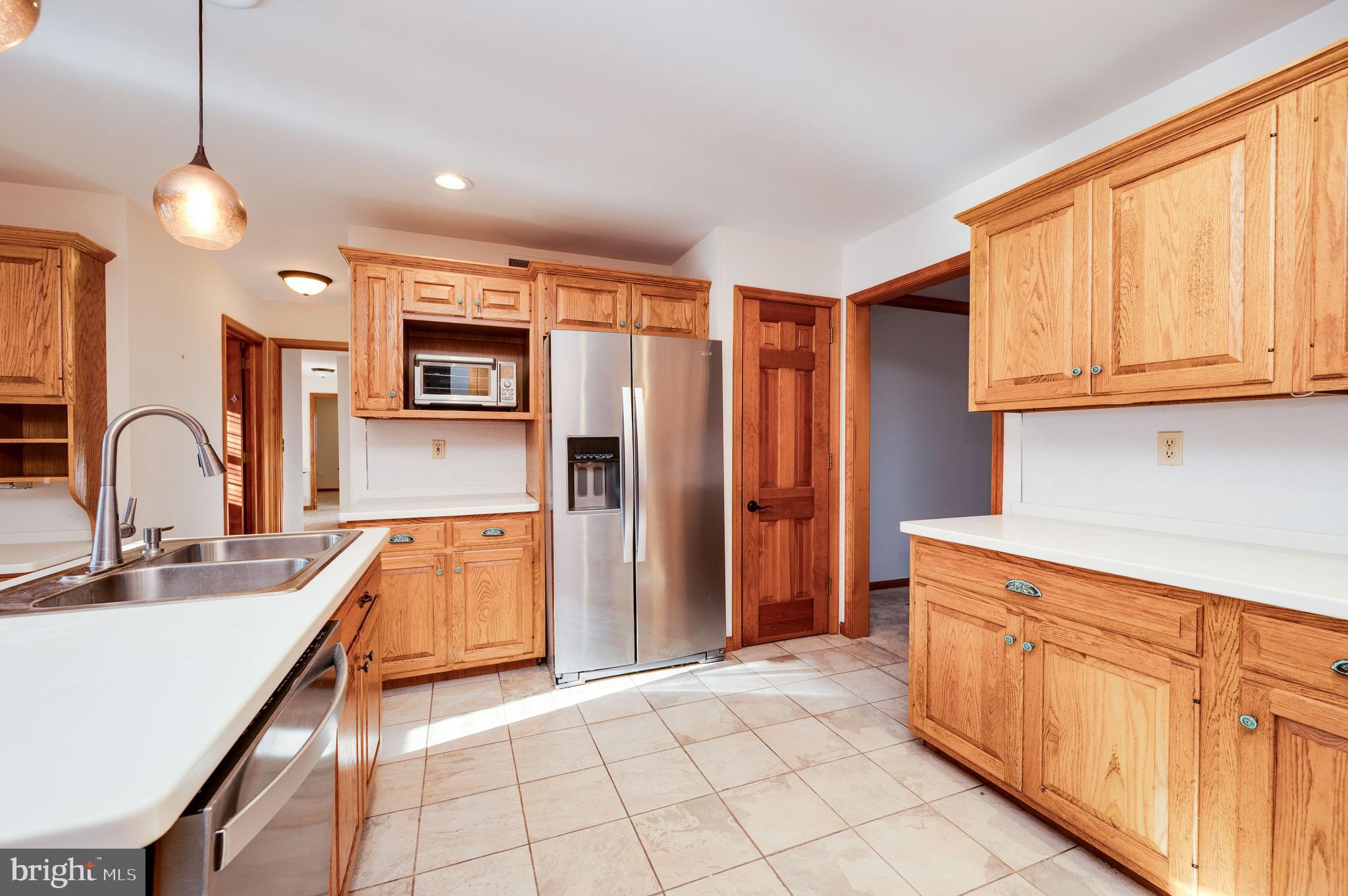109 Bewley Lane Reading, PA 19605 - Photo 43 of 87 a kitchen with stainless steel appliances granite countertop a refrigerator and a sink