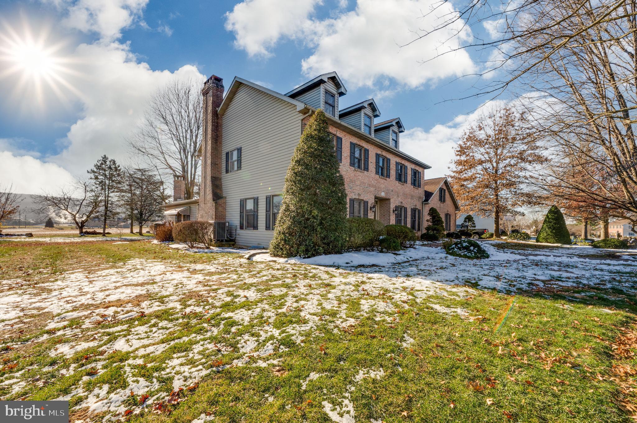 109 Bewley Lane Reading, PA 19605 - Photo 7 of 87 a front view of a house with a yard covered with snow