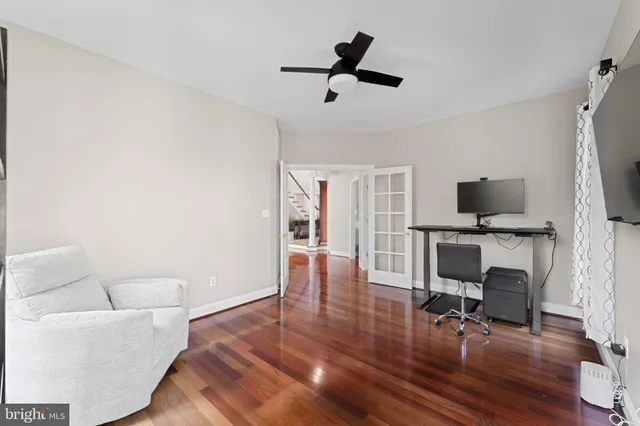 a white toilet sitting next to a bathroom