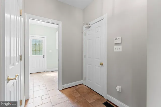a room with wooden floor and furniture
