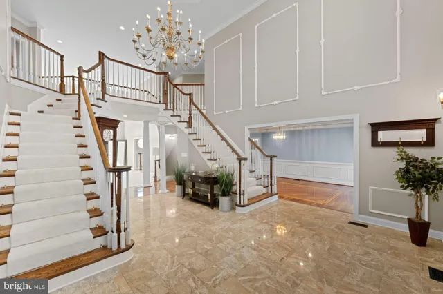 a large kitchen with a table and chairs