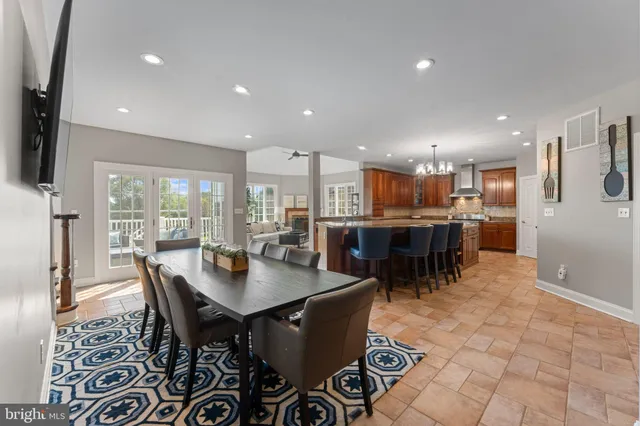a view of empty room with a fireplace and window