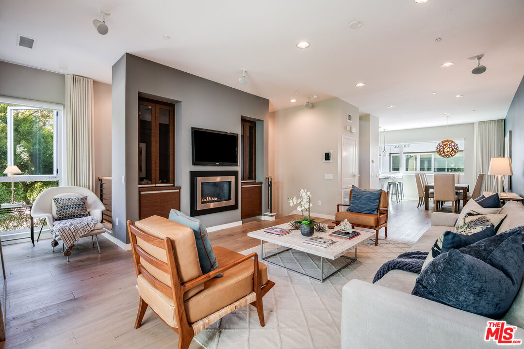 310 Washington Boulevard, Unit 401 Marina del Rey, CA 90292 - Photo 1 of 32 a living room with furniture and a flat screen tv