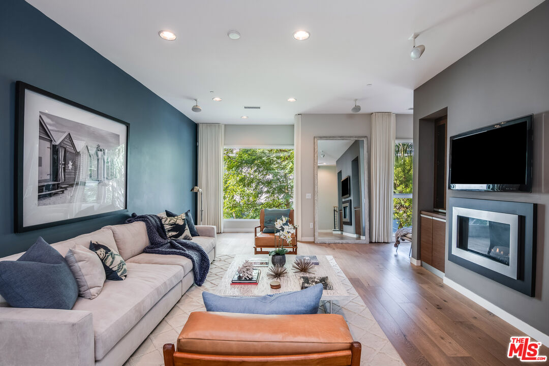 310 Washington Boulevard, Unit 401 Marina del Rey, CA 90292 - Photo 12 of 32 a living room with furniture fireplace and flat screen tv