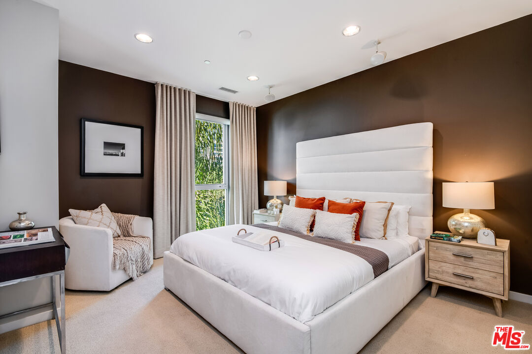 310 Washington Boulevard, Unit 401 Marina del Rey, CA 90292 - Photo 17 of 32 a bedroom with a bed and a night stand