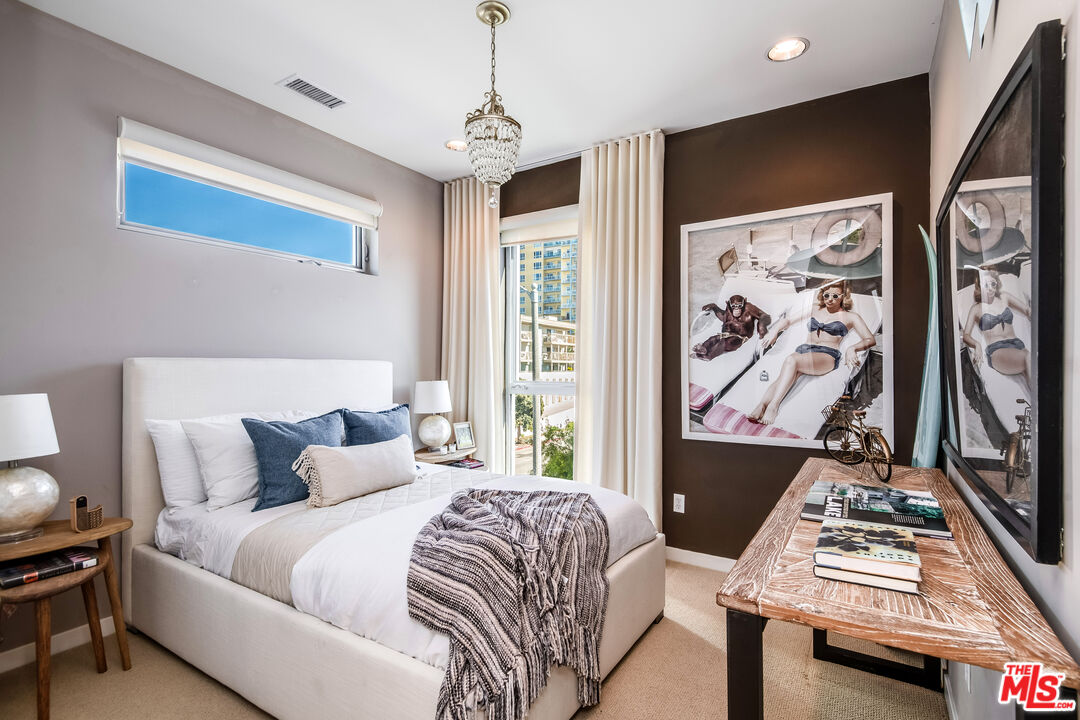 310 Washington Boulevard, Unit 401 Marina del Rey, CA 90292 - Photo 21 of 32 a bedroom with furniture and a window