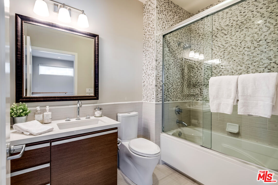 310 Washington Boulevard, Unit 401 Marina del Rey, CA 90292 - Photo 23 of 32 a bathroom with a sink a toilet and shower