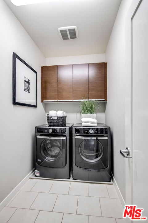 310 Washington Boulevard, Unit 401 Marina del Rey, CA 90292 - Photo 24 of 32 a kitchen with stainless steel appliances granite countertop a stove and a refrigerator
