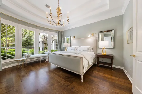 a bedroom with bed and window