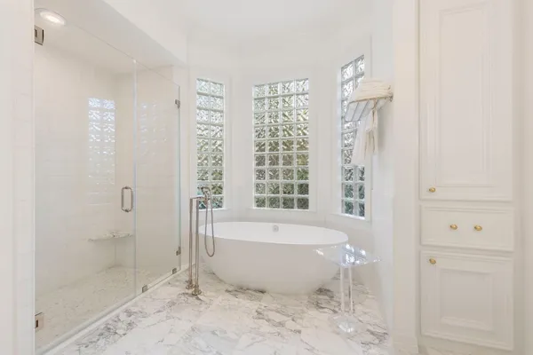 a bathroom with sink toilet and shower