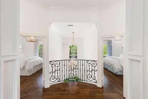 a view of bedroom with a bed and wooden floor