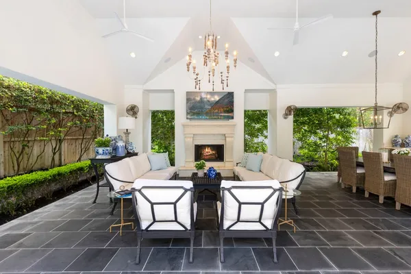 a view of a dining room with furniture wooden floor and a chandelier