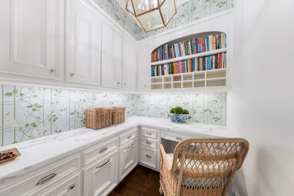 a kitchen with stainless steel appliances a cabinets and window