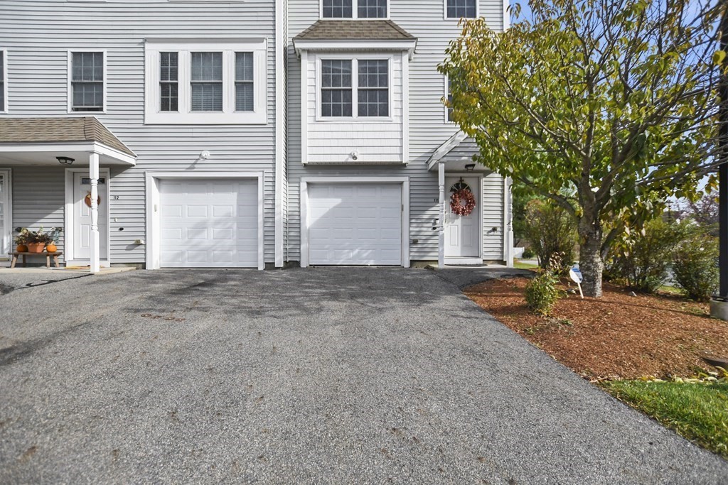 41 Boston Road, Unit 111 Billerica, MA 01862 - Photo 3 of 28 a front view of a house with a yard
