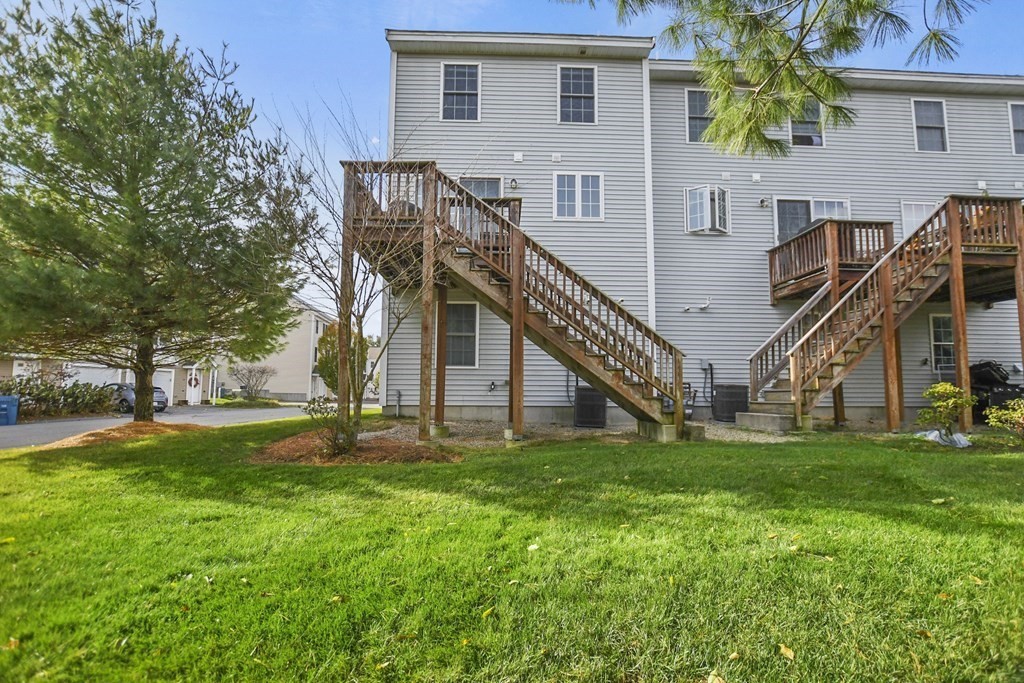 41 Boston Road, Unit 111 Billerica, MA 01862 - Photo 5 of 28 a view of a house with a yard