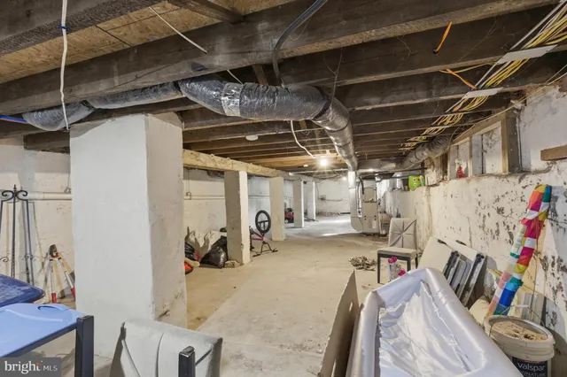 a view of a house with a yard and a tree