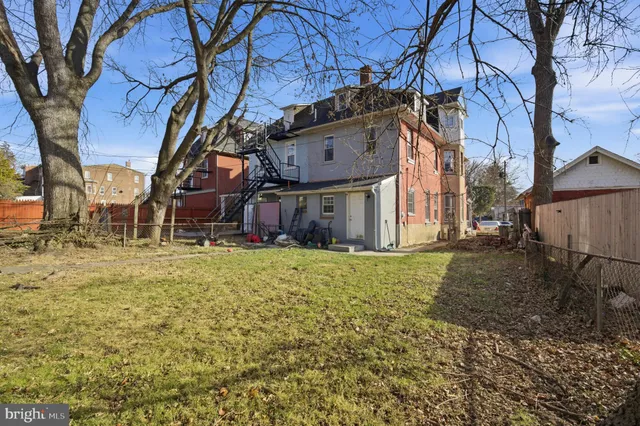 a view of swimming pool with a yard