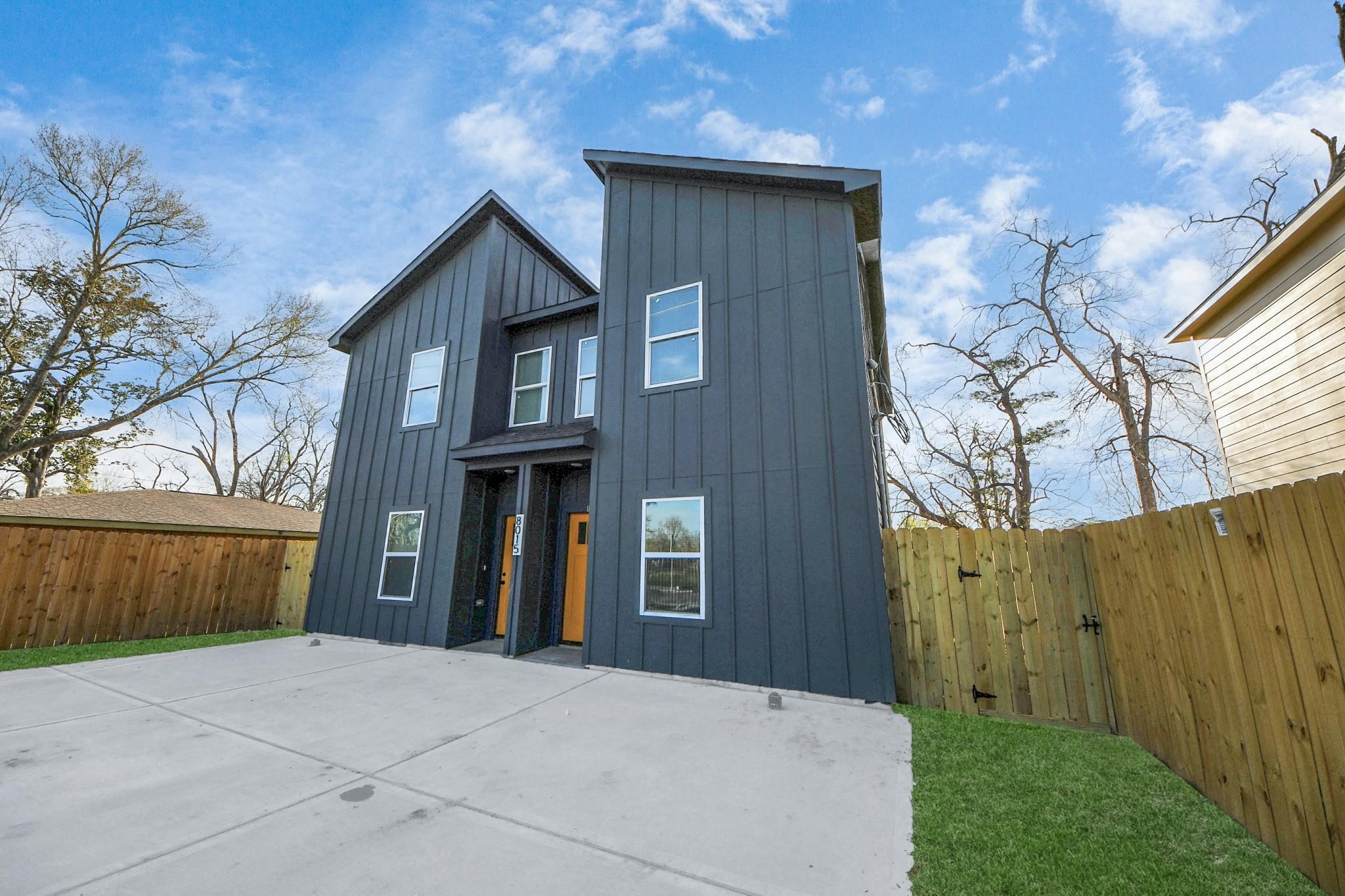 8015 Elbert Street, Unit A/B Houston, TX 77028 - Photo 2 of 12 a front view of a house with a garden