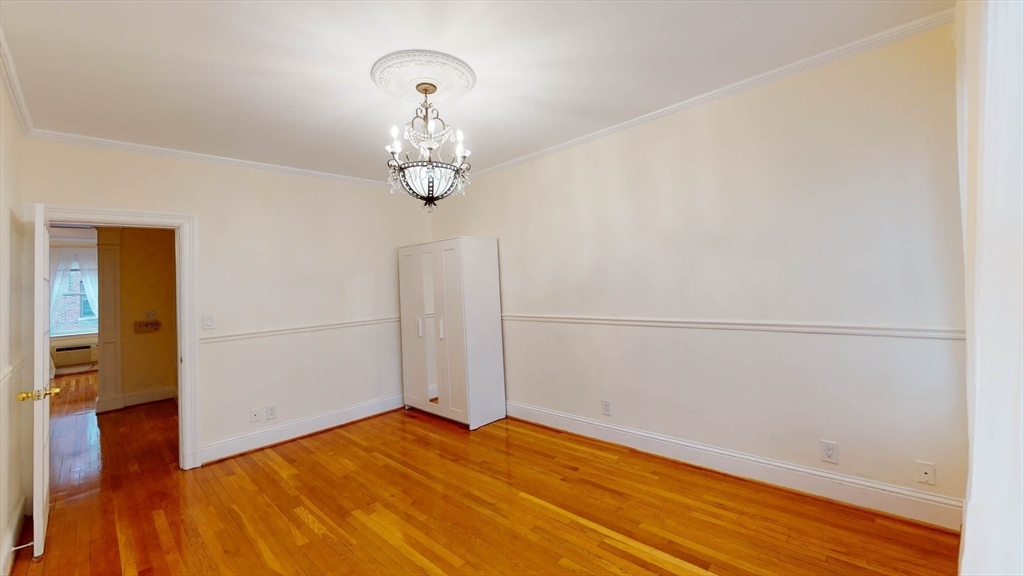 311 Tappan Street, Unit 3 Brookline, MA 02445 - Photo 22 of 35 a view of empty room with wooden floor