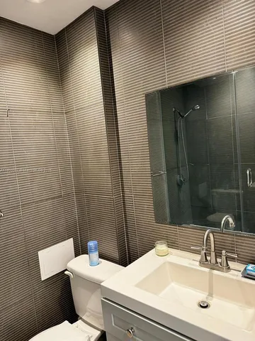 a bathroom with a sink and toilet
