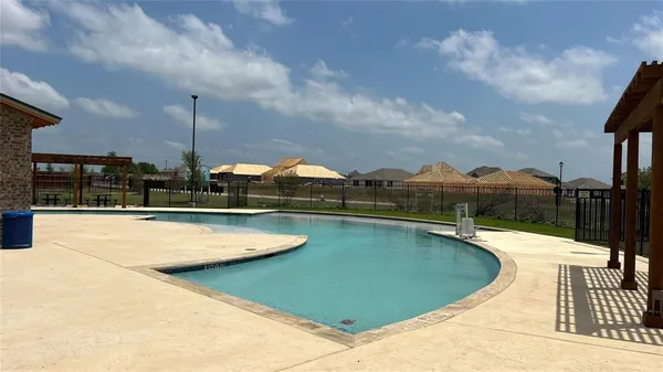 a view of a swimming pool and a terrace