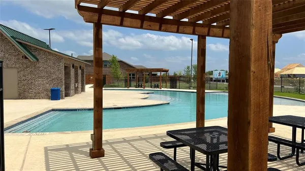 a view of swimming pool with patio
