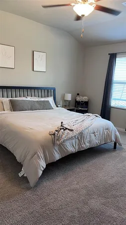 a bedroom with a bed and flat screen tv