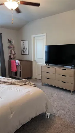 a bedroom with a bed and a table in it