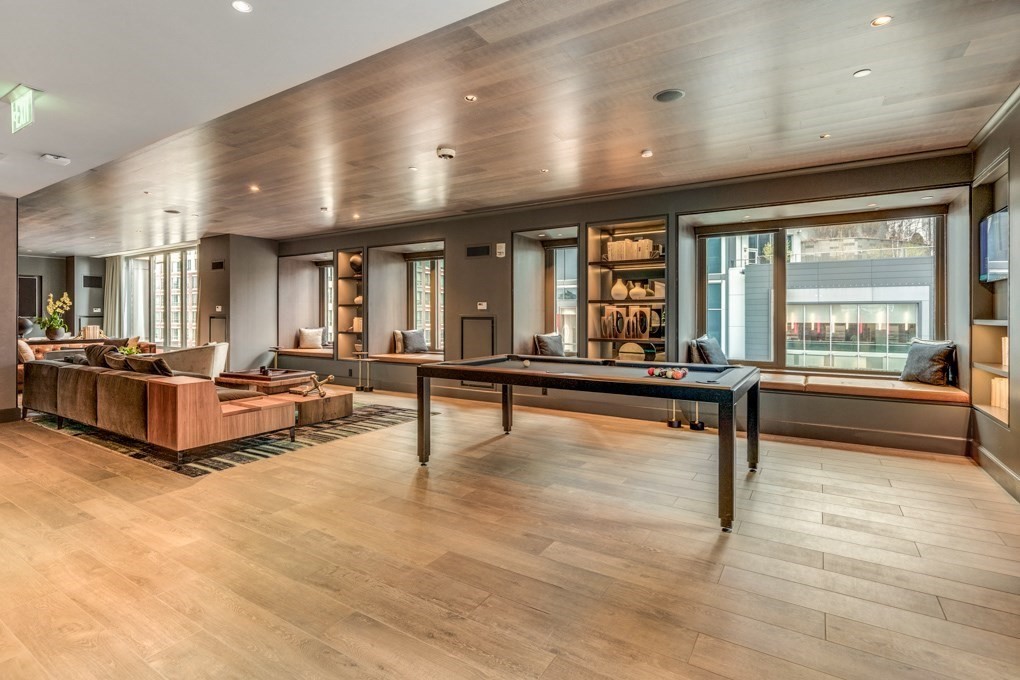 1350 Boylston Street, Unit L415 Boston, MA 02215 - Photo 13 of 16 a living room with furniture pool table wooden floor and windows
