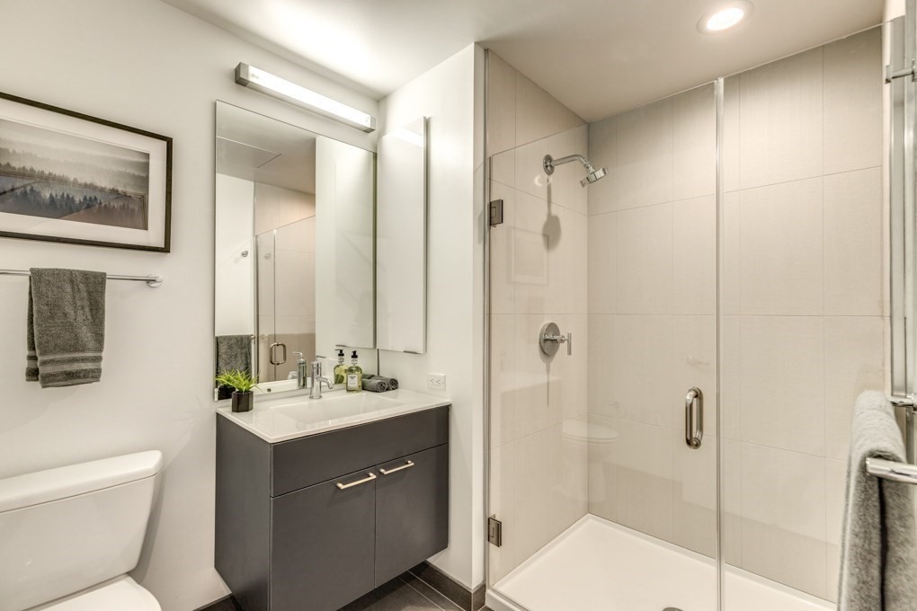 1350 Boylston Street, Unit L415 Boston, MA 02215 - Photo 10 of 16 a bathroom with a double vanity sink mirror and toilet
