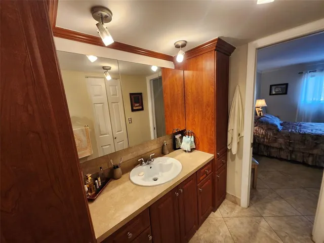 a view of a house with a yard and a garage