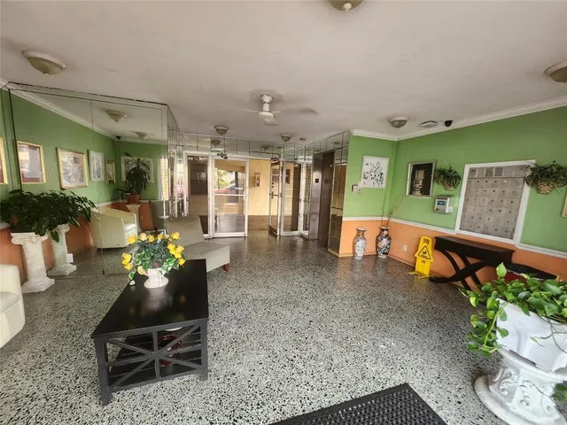 a view of a kitchen with a refrigerator and a stove