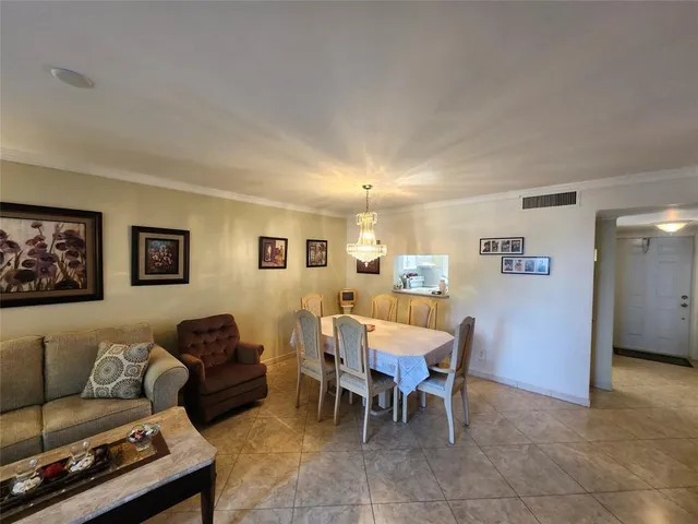 a kitchen with cabinets stainless steel appliances and a counter space