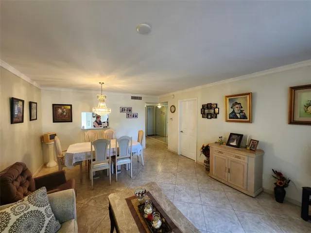 a kitchen with a refrigerator sink stove and cabinets