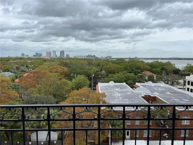 a view of a balcony with furniture