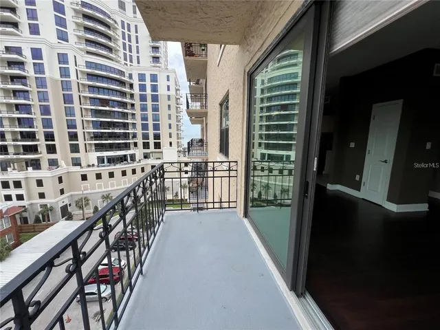a view of balcony with wooden floor