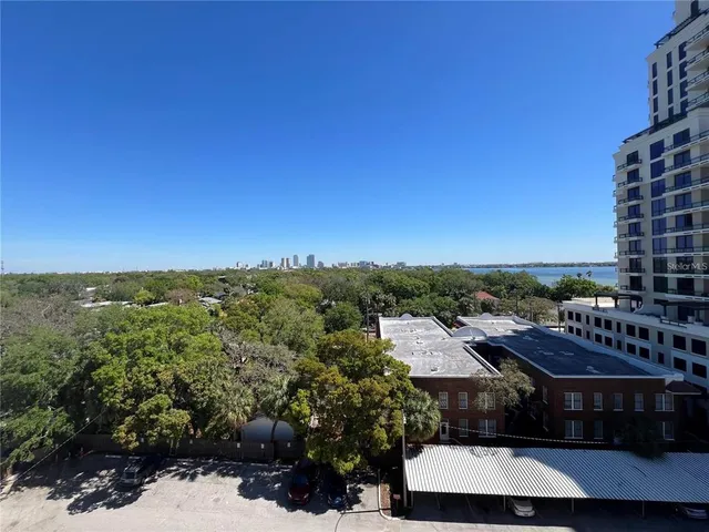 a view of a city with a building in the background