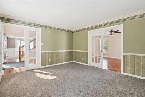 a bathroom with a sink mirror and toilet