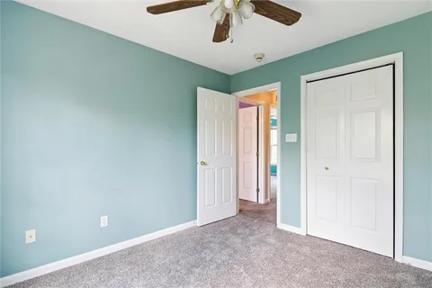 a bathroom with a sink toilet vanity and shower