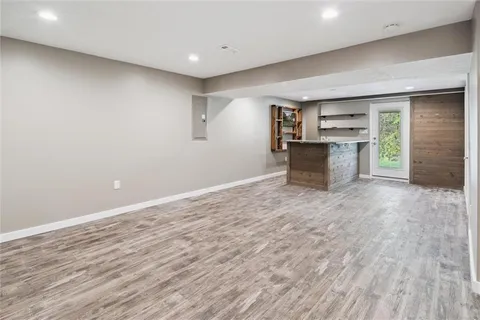 a kitchen with kitchen island a counter top space and a sink