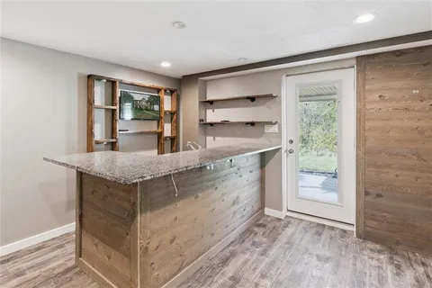 a bathroom with a shower and a sink