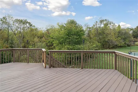 a view of a house with backyard and porch