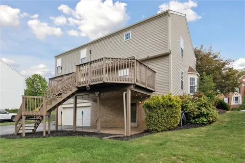 a view of outdoor space with deck and yard