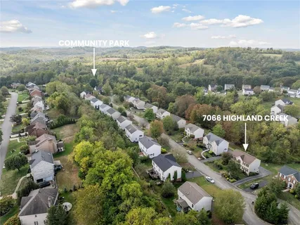 an aerial view of a town with couple of houses