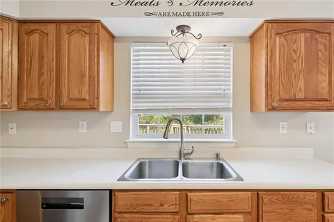 a kitchen with a sink and cabinets
