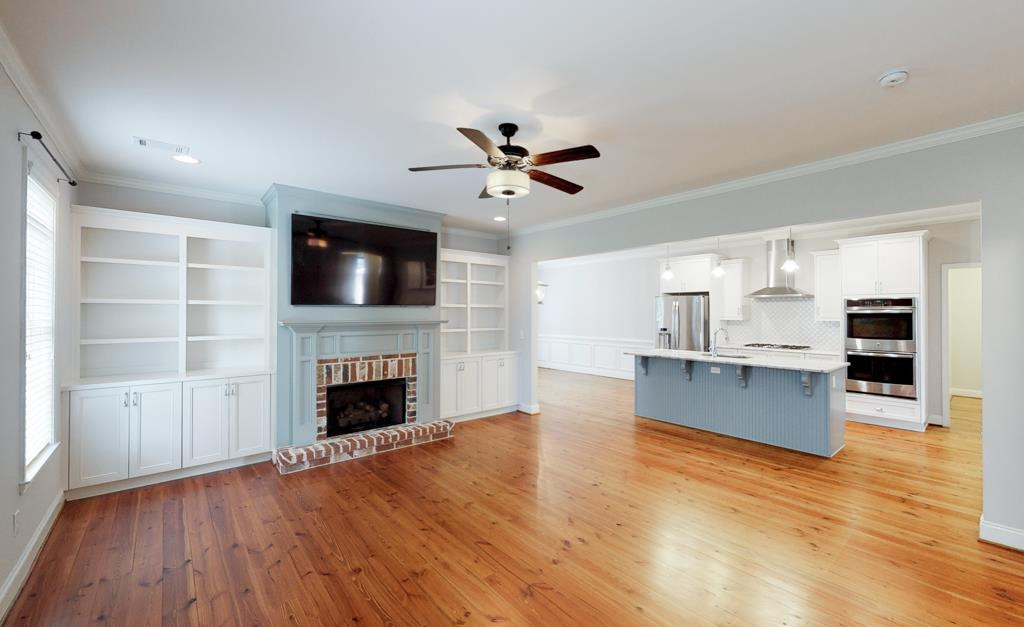 828 River Bluff Road North Augusta, SC 29841 - Photo 7 of 33 Custom built ins & gas fireplace opens up wonderfully to amazing kitchen!