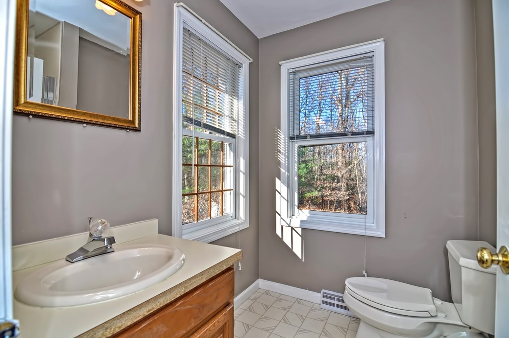 43 Stall Brook Road, Unit 43 Milford, MA 01757 - Photo 12 of 27 a bathroom with a sink toilet and tub